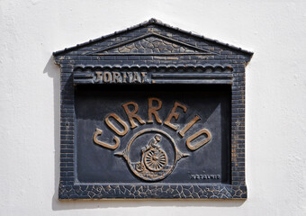 Ancient mail box on facade (