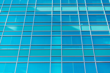 underside panoramic and perspective view to steel blue glass high rise building skyscrapers, business concept of successful industrial architecture