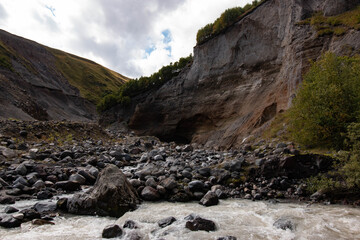 high cliffs and stormy river