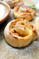 Sweet puff pastry roll for breakfast or snack served with honey and milk. Top view with copy space. Healthy food.
