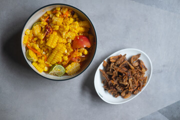 Corn spicy salad served with crispy fish