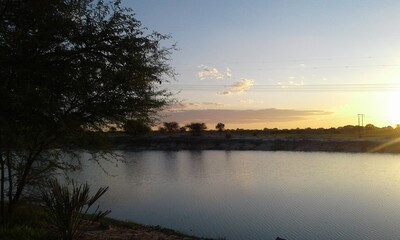 Fototapeta na wymiar sunset over the oshana water pan.