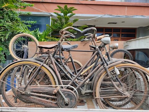 Rusty old bicycle on open car