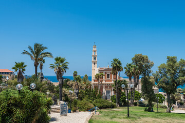Obraz premium Bell tower and facade of the Saint Peter Church, Franciscan church in Old Jaffa in Tel Aviv Yaffo, Israel, View from the top of the hill in Jaffa old city.