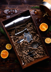 Bartender and barman tools for making cocktails and drinks bar counter black background copyspace