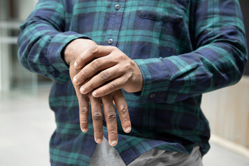 African man suffering from wrist or hand pain, sick black man with cps wrist pain, trigger finger,...