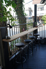 Interior design and decoration of coffee cafe and bakery shop decorated with wooden furniture and black brick wall in industrial loft style