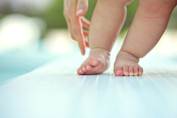 Barefoot child standing close up. Healthy baby feet