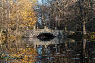 The picturesque stone bridge across the river Cristatella Park Sergievka near the town Lomonosov.