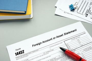 Conceptual photo about Form 14452 Foreign Account or Asset Statement with written text.