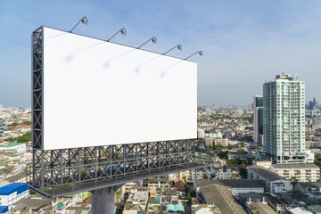 Blank white road billboard with Bangkok cityscape background at day time. Street advertising poster, mock up, 3D rendering. Side view. The concept of marketing communication to promote or sell idea. © VideoFlow