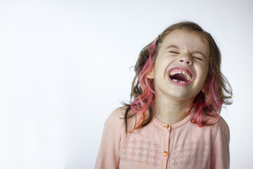 Adorable little kid girl laughing on white