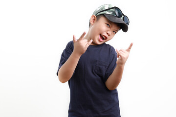 Stylish cute little Asian boy wearing cap and sunglasses posing on white background