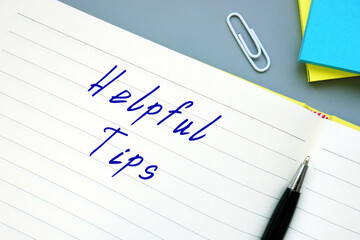 Financial concept about Helpful Tips with phrase on the sheet.