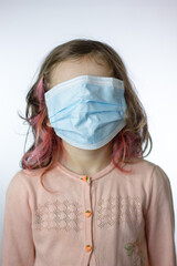 Little kid girl with a mask on a face, face closed totally