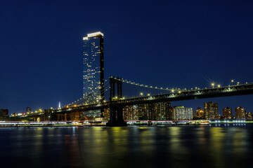 Fototapeta na wymiar Manhattan Bridge with Brooklyn New York City skyscrapers city over Hudson River New York, night scene