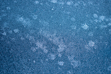 Abstract and ornamental detailed texture of frozen ice crystals pattern on the car or table or wall 