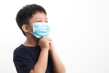 Portrait of a 9-year-old Asian boy wearing protection mask praying for a new day freedom to Covid-19 isolated over white background.
