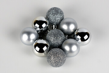Silver christmas balls in a diamond shape close up view selective focus
