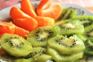 kiwi and orange healthy food on plate