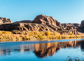 Fototapeta na wymiar Red Rock Cliffs Reflecting On The Lower Colorado River, Potash Road, Moab, Utah, USA