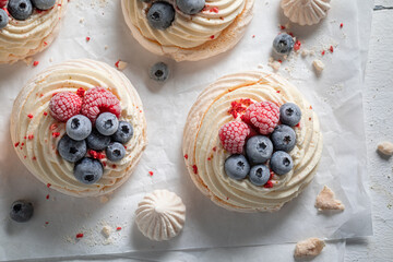 Homemade mini Pavlova cake made of frozen berries and mascarpone
