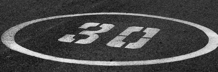 number 30 painted on the asphalt