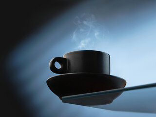 Cup of fresh coffee on blue background