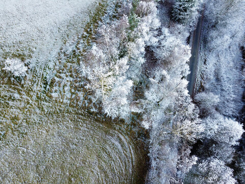 Aerial photos of a field in winter landscape on a sunny cold day