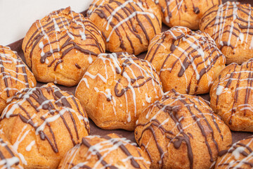 Profiteroles with white and dark chocolate filling
