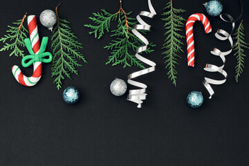 New Year's, festive decor on a black background. Copy space, flat lay, mock up, top view.