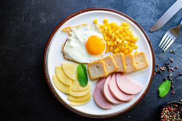 breakfast fried egg, bread toast, vegetables, corn, cheese and more on the table serving healthy meal snack ingredient top view copy space for text food background rustic