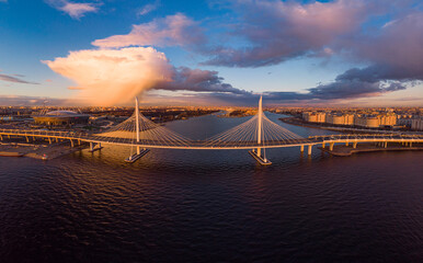 Aerial Panoramic view to evening St. Petersburg and Cable-stayed bridge across Petrovsky fairway....