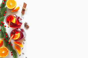 Christmas decorations. Mulled wine and ingredients on the left side of the frame on a white background. Top view