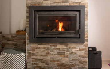 Naklejka premium BEAUTIFUL WOODEN FIREPLACE INSCRIBED IN THE WALL