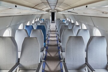 Empty rows of seats on an old plane