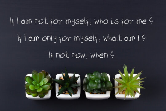 Text written in chalk on a black board. If I am not for myself, who is for me? If I am only for myself, who am I? If not now, when? Quote of the sage Hillel.