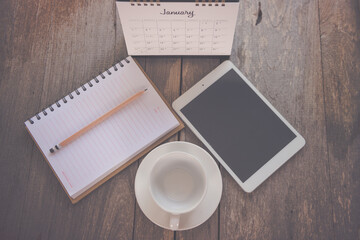 Calendar 2021 assignments with blank notes for making lists on the old wooden table.