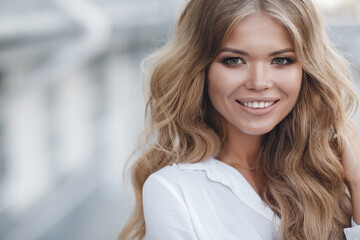 Close up portrait of a happy beautiful woman in glasses outdoor