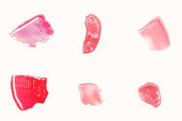 A collection of different lipstick smears on a white background each shot separately