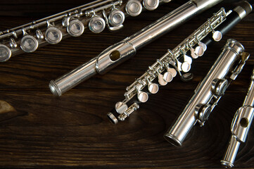 flute parts laid out on a wooden surface © viktor