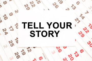 text TELL YOUR STORY on a sheet from Notepad.a digital background. business concept . business and Finance.