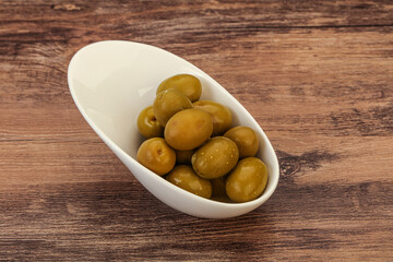 Green pickled olives in the bowl