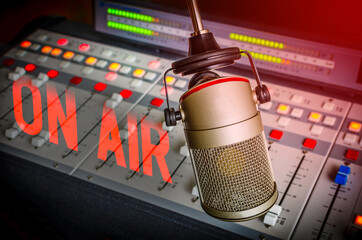 background with professional microphone and sound mixer