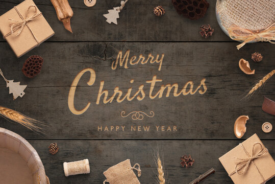Merry Christmas and Happy New Year greeting card. Rustic top view composition. Carving handwork on wooden surface