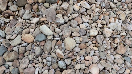 stones and large stones placed on the ground, close-up view.