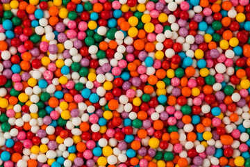 Fototapeta na wymiar coloured edible balls for decoration of cakes and desserts