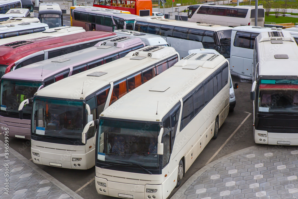 Wall mural Tourist buses in a parking lot