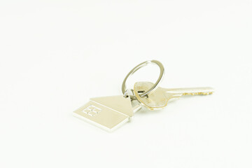 the door key isolated on white background the concept of a home purchase