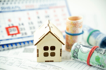 a receipt for the utilities in the background of the calendar. the concept of higher taxes for...